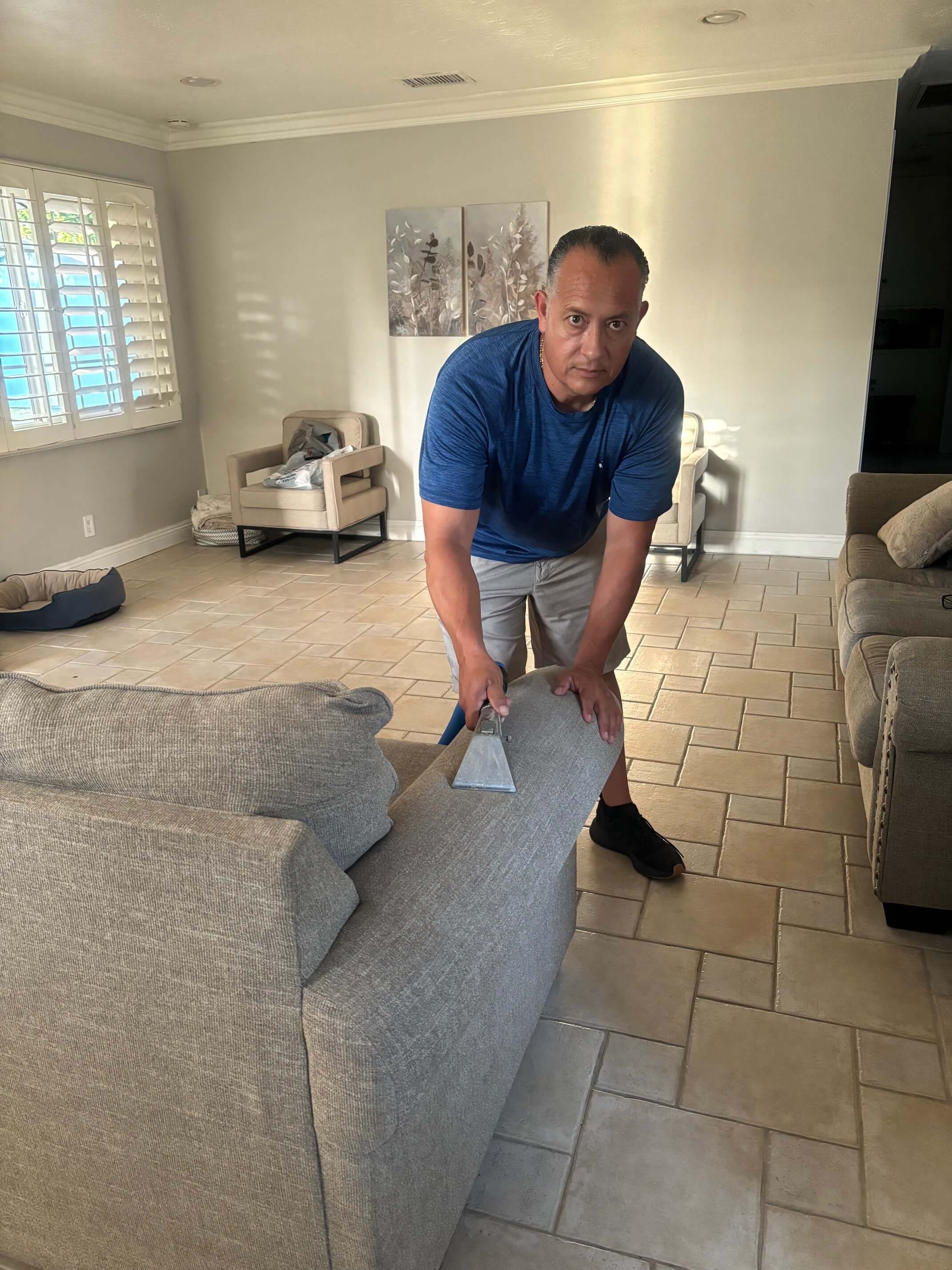 owner cleaning the tiles with his thumbs up